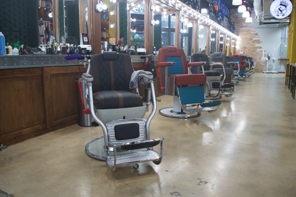 inside the spot barber shop with rows of chairs