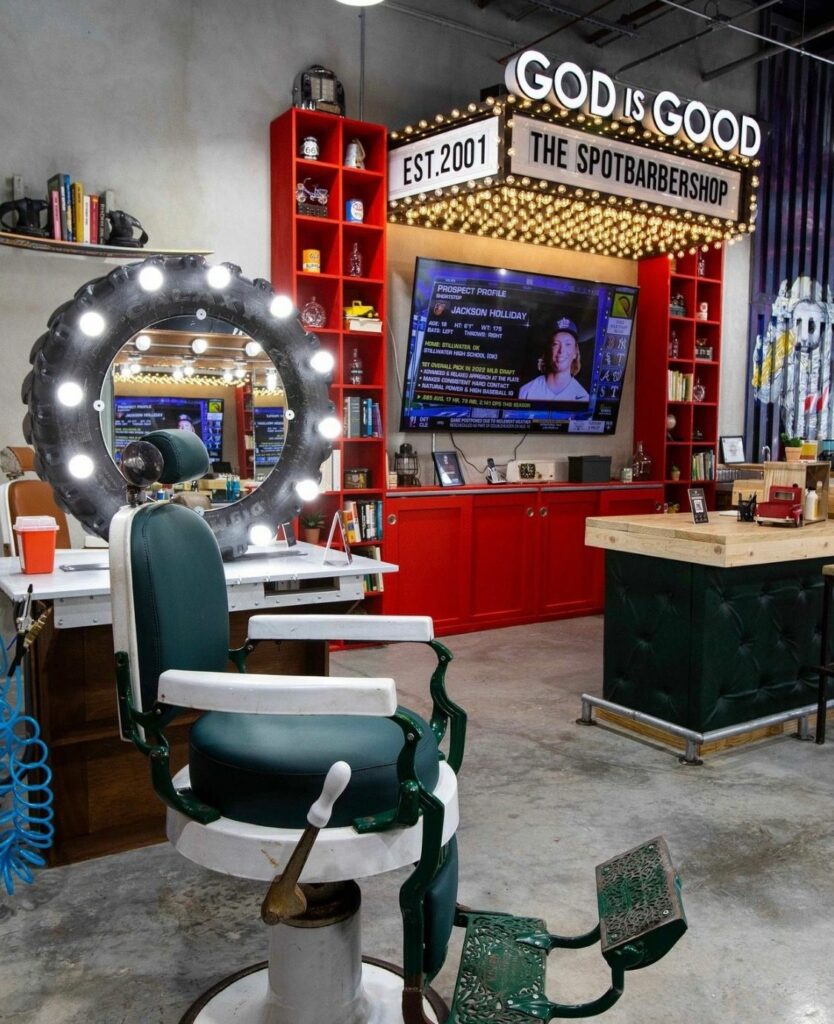 inside the spot barber shop with white green chair