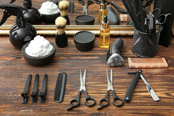 set of barber tools on wooden table